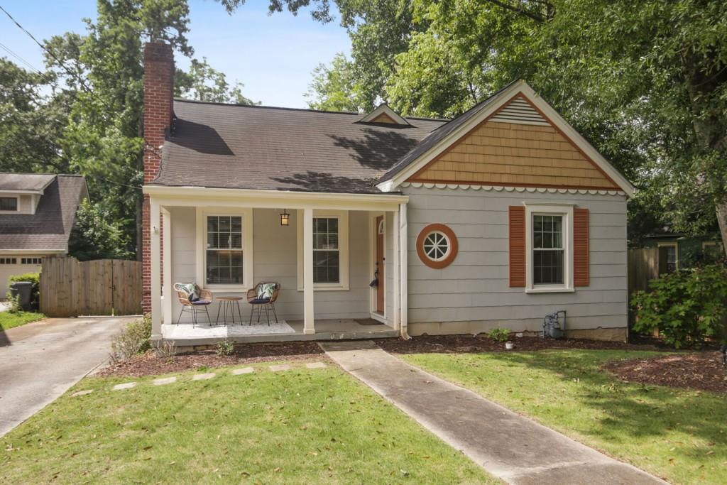 a view of house with yard