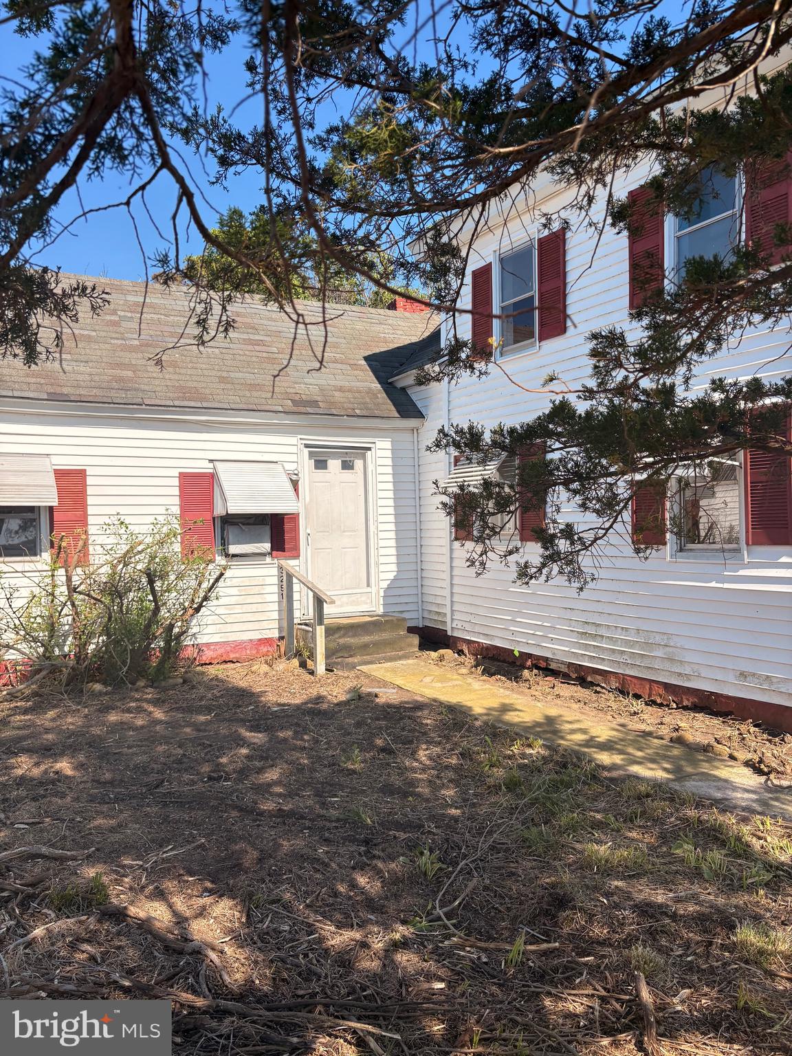 3251 Marsh Road Ewell, MD 21824 - Photo 28 of 32 a front view of a house with a yard