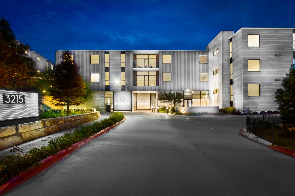 a city street lined with tall buildings