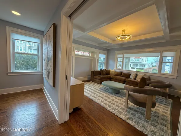 a bathroom with a granite countertop tub sink and mirror