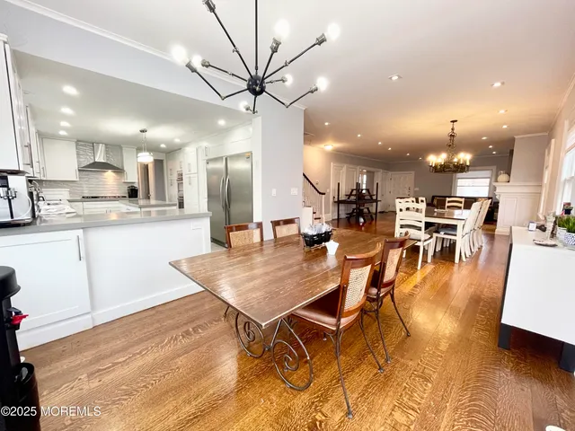 a view of a dining area with furniture and wooden floor