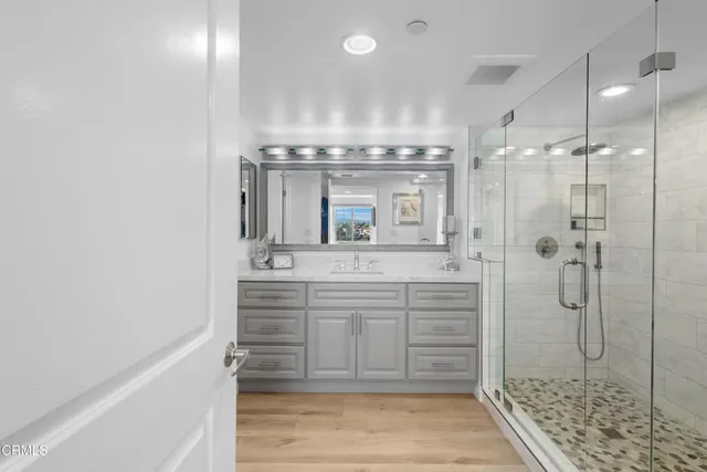 a bedroom with a large bed and a large window