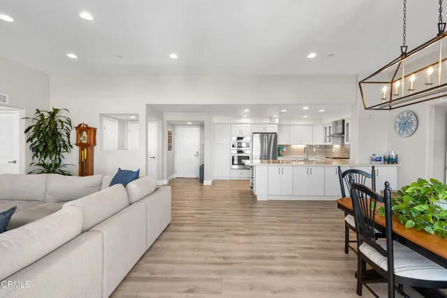 a view of room with hardwood floor and cabinet