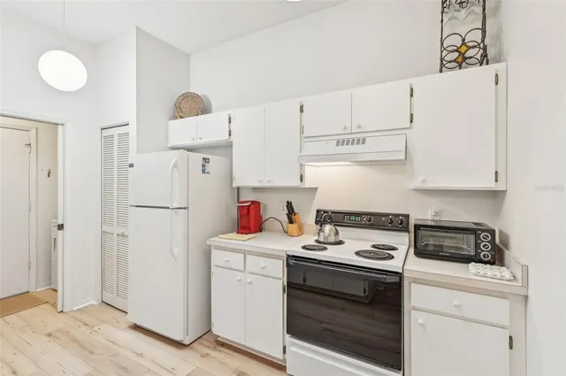 a spacious bathroom with a sink double vanity and a mirror