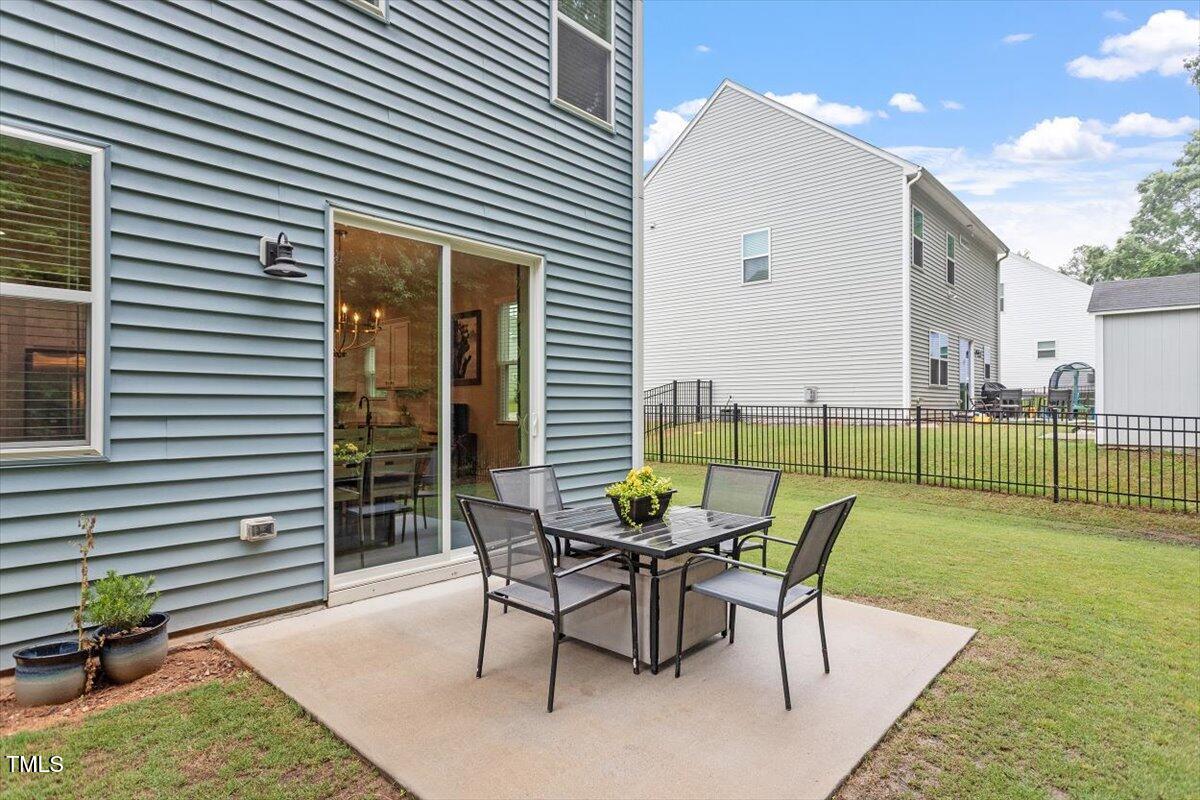 320 Everly Mist Way Wake Forest, NC 27587 - Photo 22 of 34 a view of a backyard with furniture and a backyard