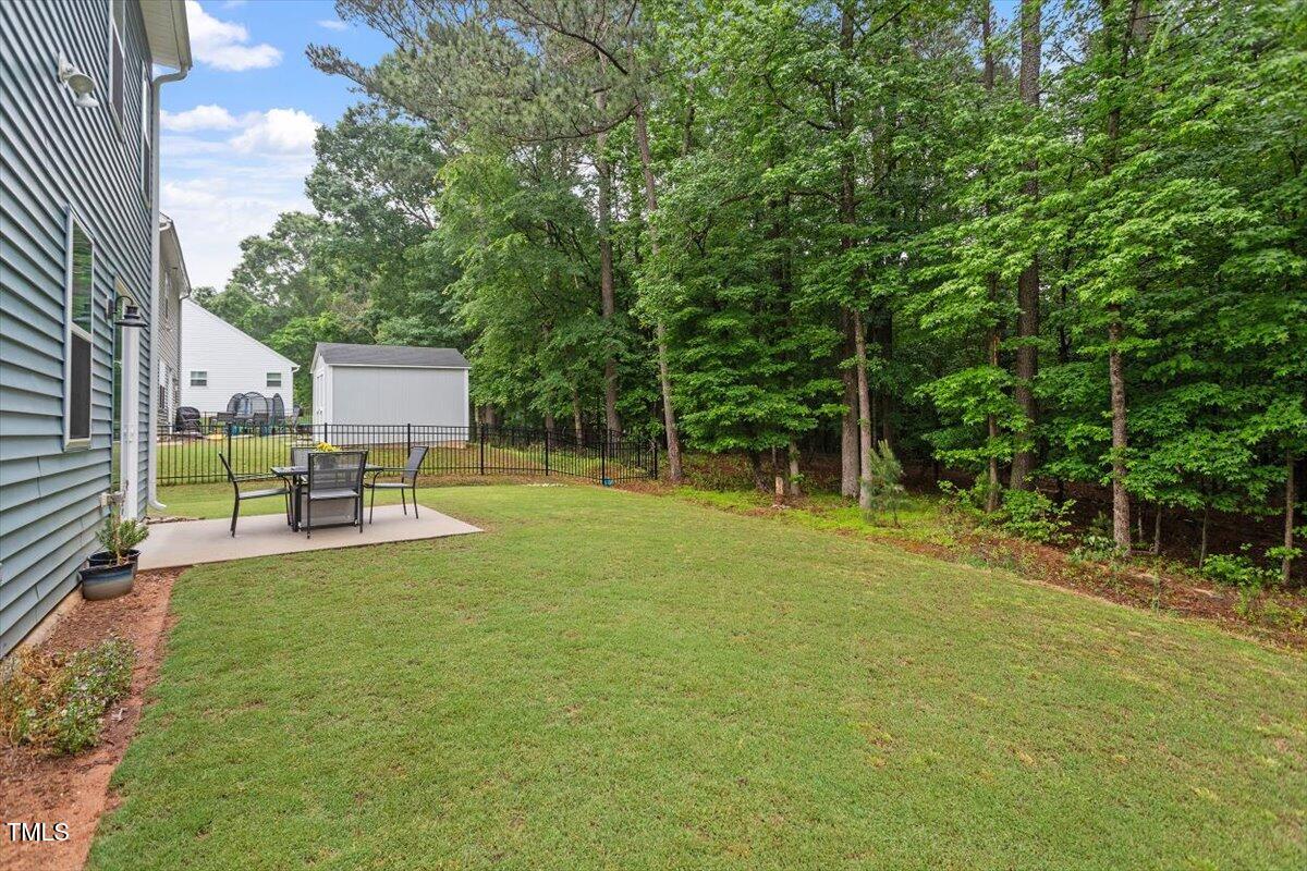 320 Everly Mist Way Wake Forest, NC 27587 - Photo 23 of 34 a view of a chair and table on the garden
