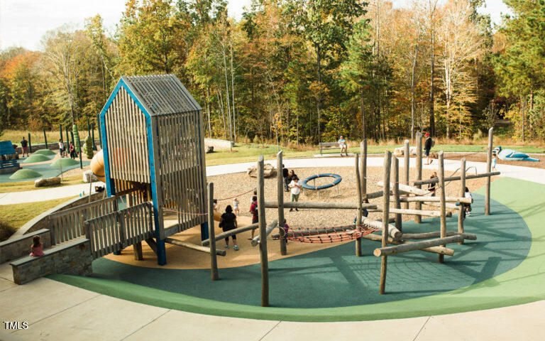 320 Everly Mist Way Wake Forest, NC 27587 - Photo 26 of 34 swimming pool view with outdoor seating