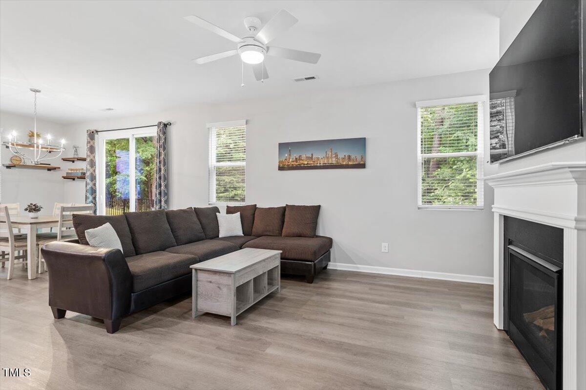 320 Everly Mist Way Wake Forest, NC 27587 - Photo 8 of 34 a living room with furniture and a fireplace