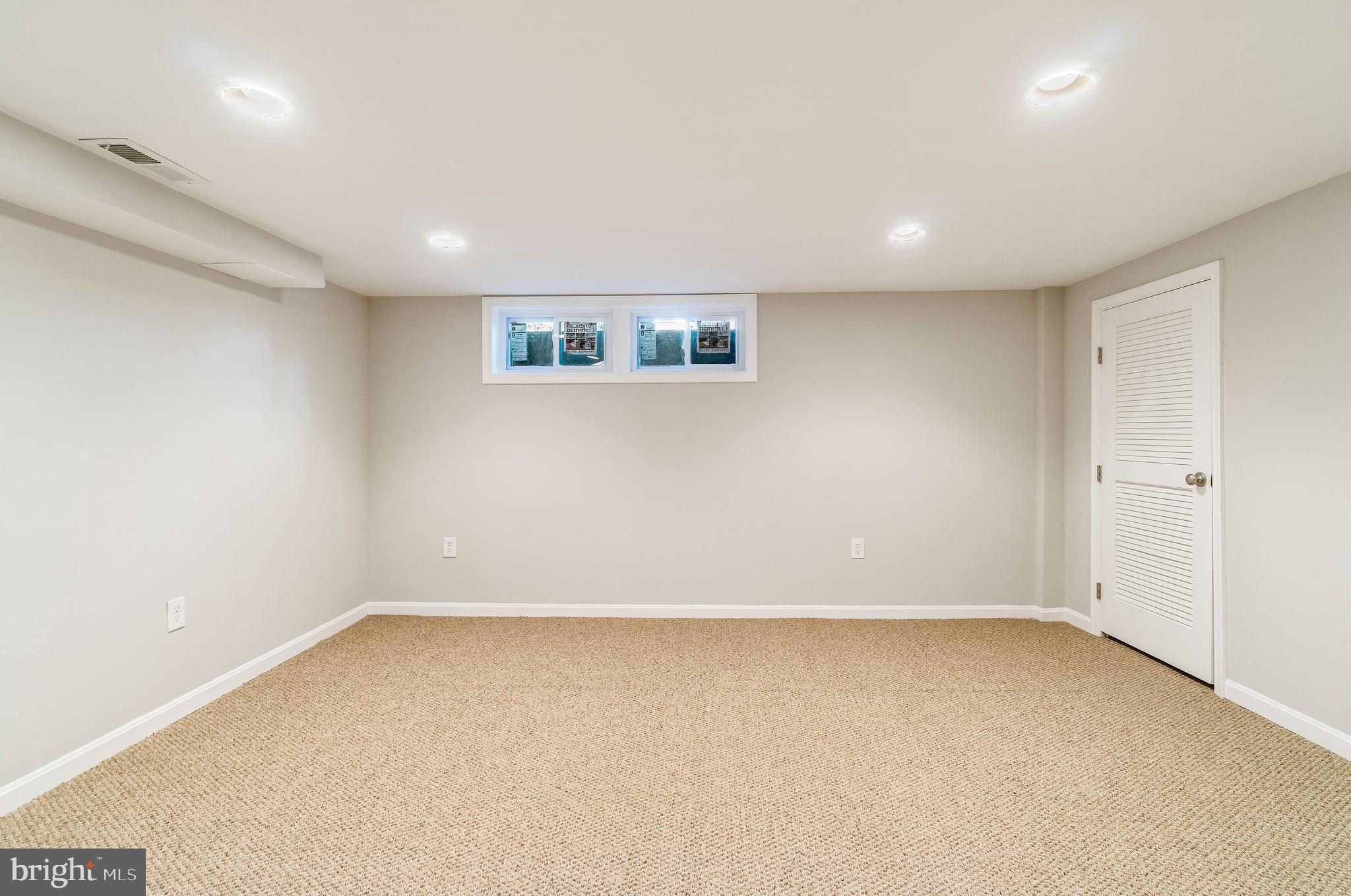 4553 Marble Hall Road Baltimore, MD 21239 - Photo 26 of 32 Lower Level - Family room with Wall to Wall Carpet