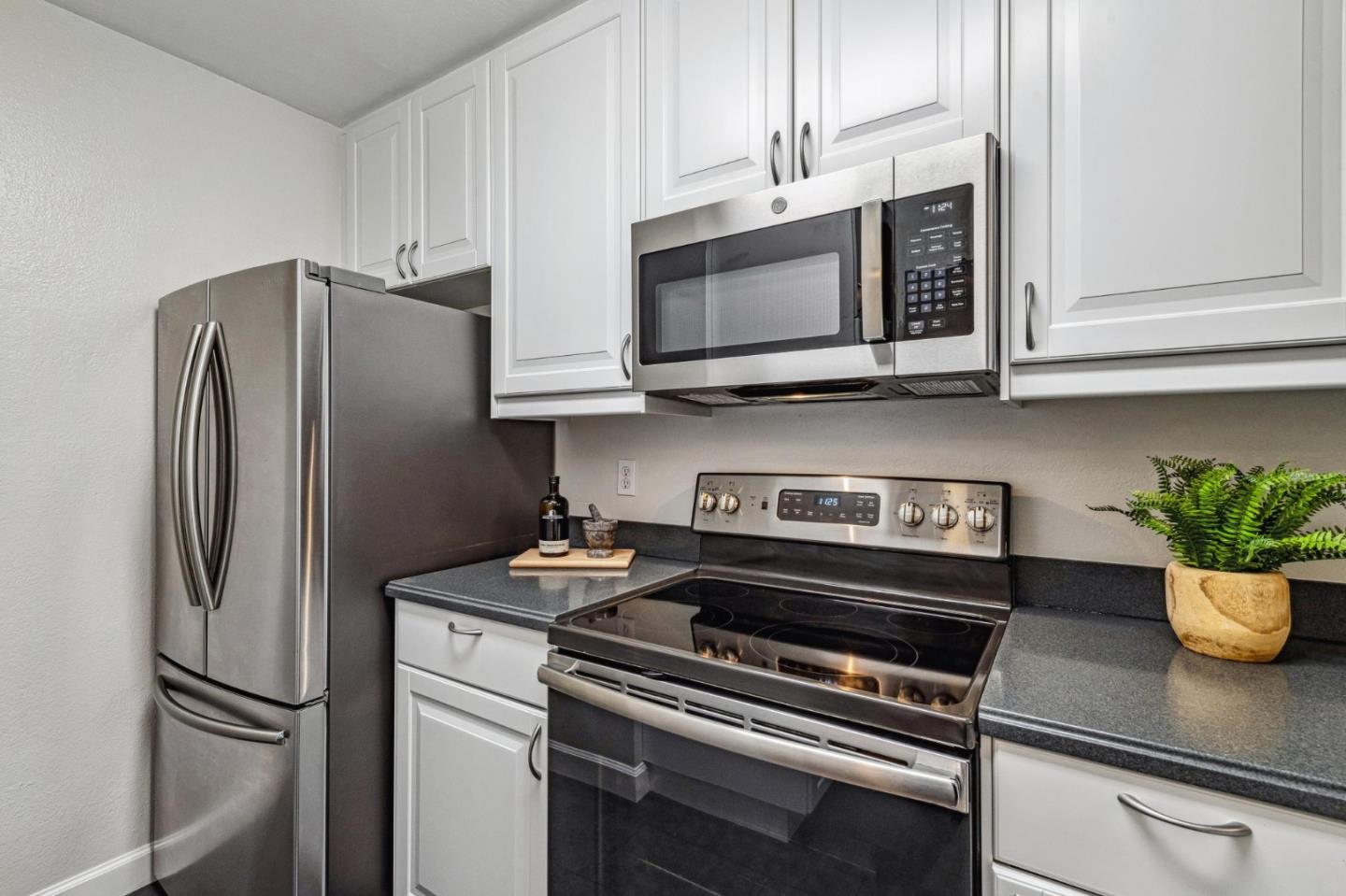 1337 Terra Nova Boulevard Pacifica, CA 94044 - Photo 7 of 21 a kitchen with stainless steel appliances a refrigerator a stove a microwave cabinets and a sink