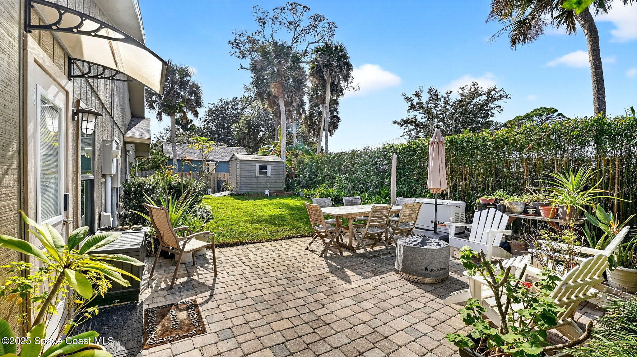 1100 South Riverside Drive Edgewater, FL 32132 - Photo 45 of 67 Cute backyard with firepit