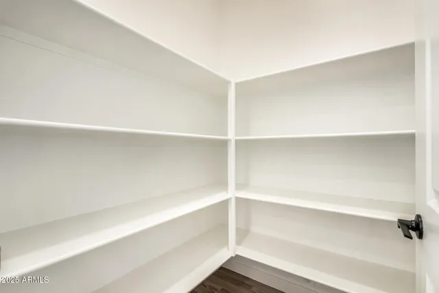 a room with a sink and a mirror