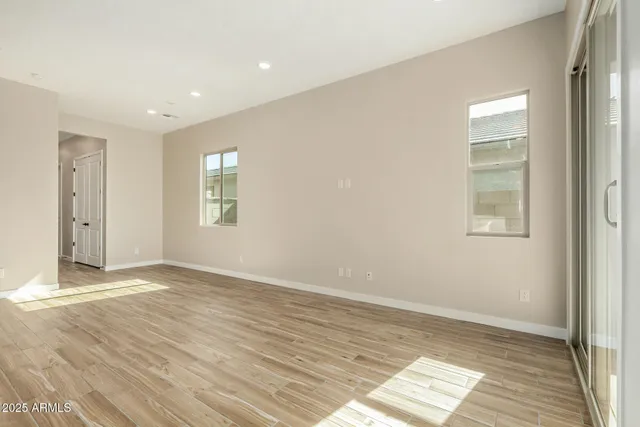 a view of a kitchen with wooden floor and a kitchen