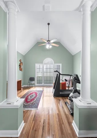 a bed room with furniture and wooden floor