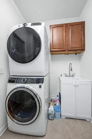 a view of a storage & utility room with a washer dryer