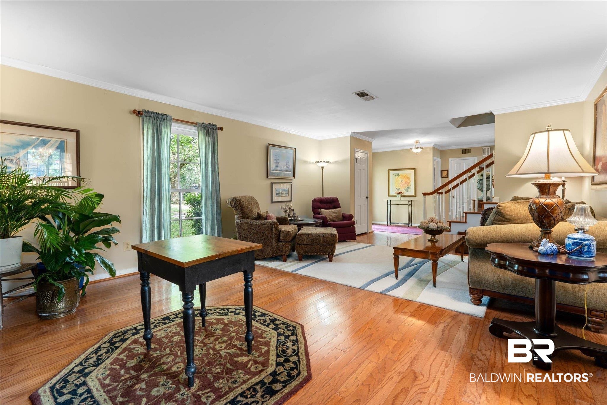 559 East Cumberland Road Mobile, AL 36608 - Photo 4 of 48 Living room featuring light wood-style floors and crown molding