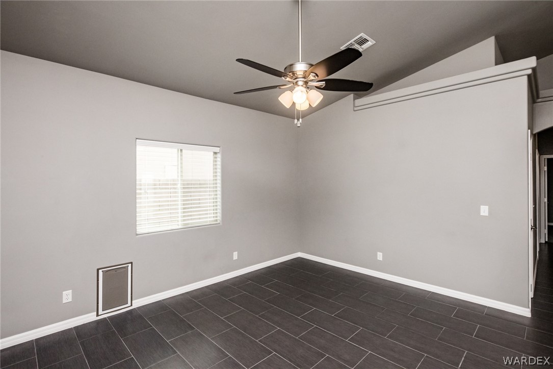3621 North Kenneth Road Kingman, AZ 86409 - Photo 13 of 47 a view of an empty room with a window