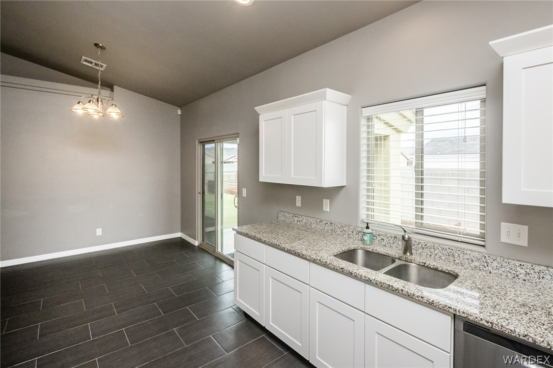 3621 North Kenneth Road Kingman, AZ 86409 - Photo 23 of 47 a kitchen with a sink cabinets and window