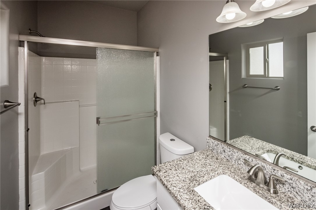 3621 North Kenneth Road Kingman, AZ 86409 - Photo 27 of 47 a bathroom with a sink toilet and shower