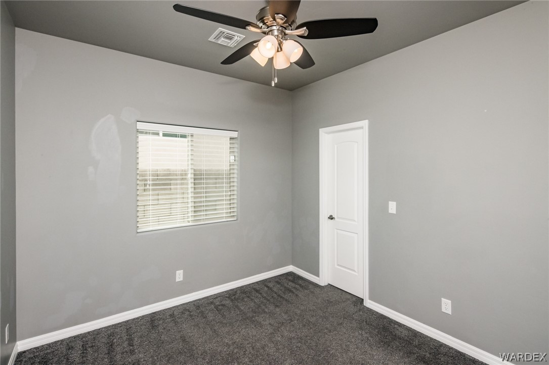 3621 North Kenneth Road Kingman, AZ 86409 - Photo 29 of 47 a view of an empty room with a window