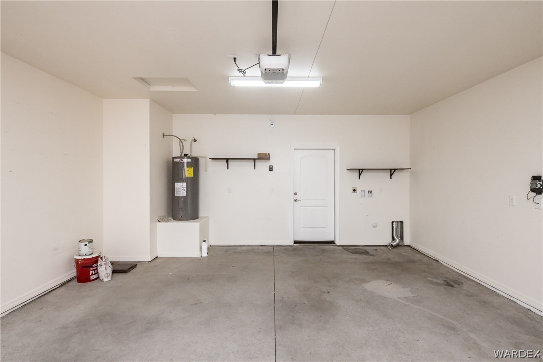 3621 North Kenneth Road Kingman, AZ 86409 - Photo 36 of 47 a view of a room with cabinet a chandelier fan and windows