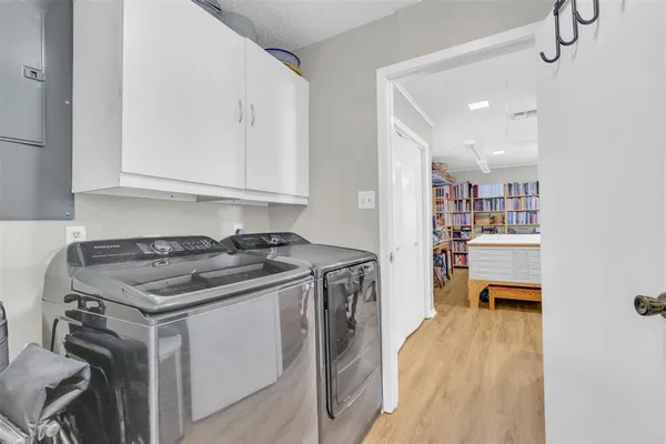 a bedroom with a large bed and a couch