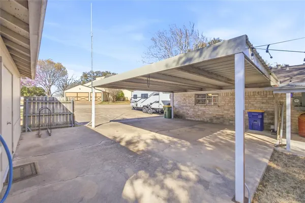a view of a park with large trees