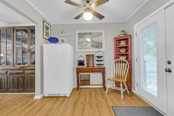 a view of a livingroom with furniture and a window