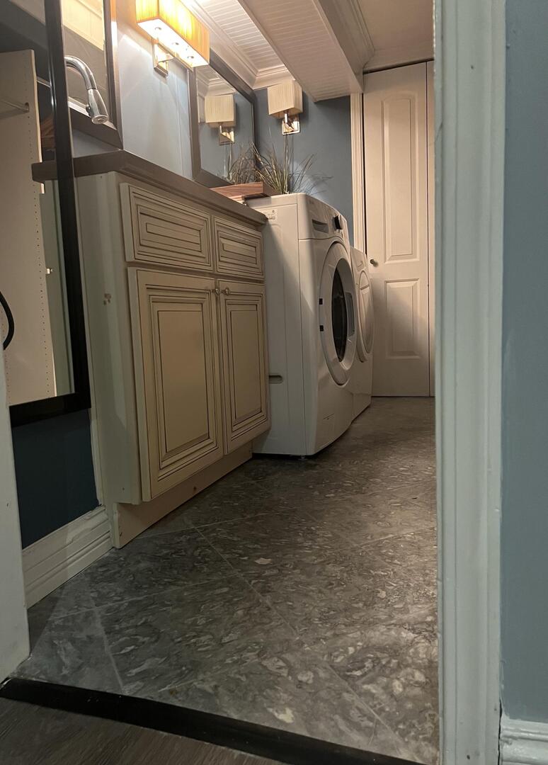9121 Niles Center Road, Unit 2W Skokie, IL 60076 - Photo 11 of 12 a view of a storage & utility room with washer and dryer