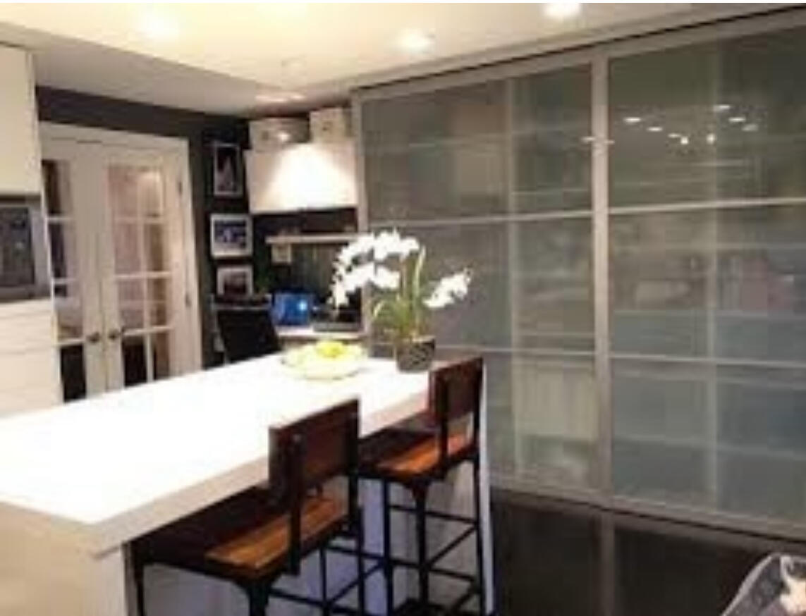 9121 Niles Center Road, Unit 2W Skokie, IL 60076 - Photo 3 of 12 a dining room with furniture and window