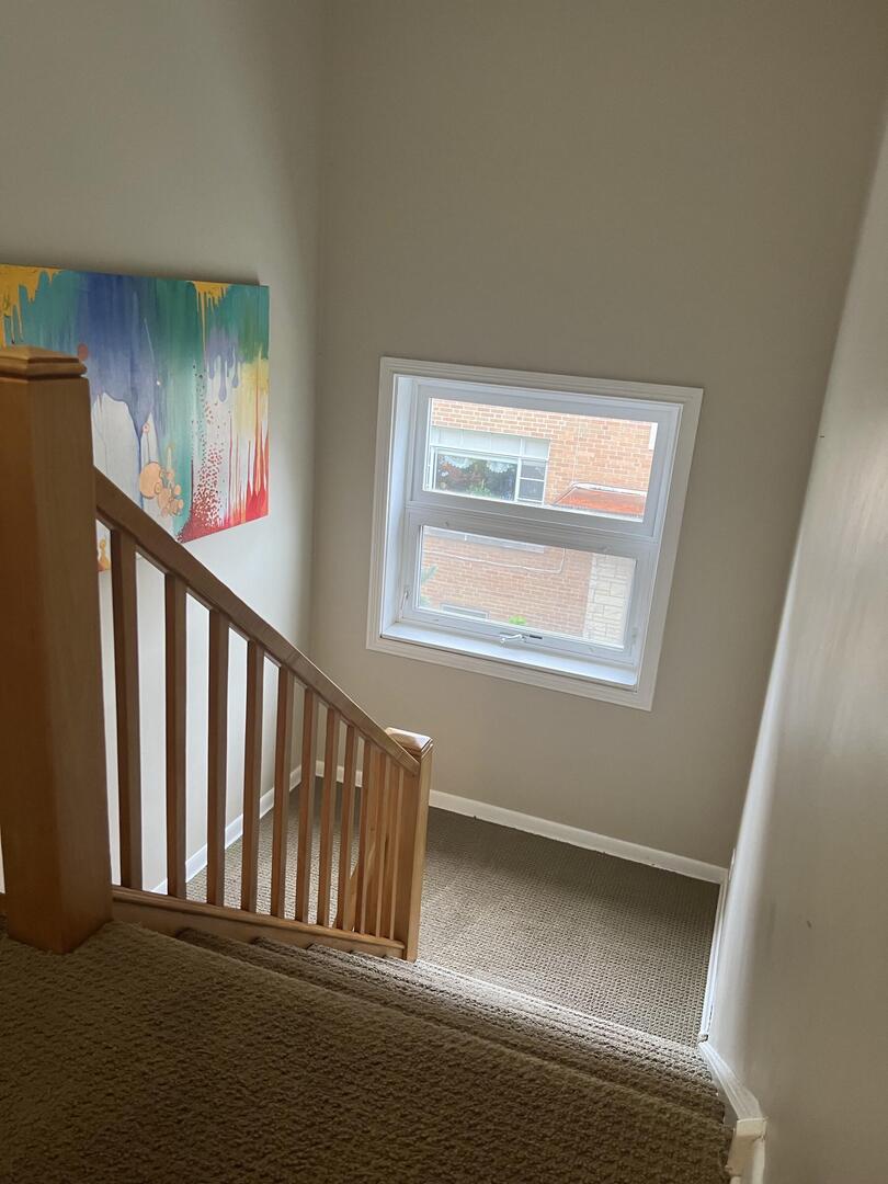 9121 Niles Center Road, Unit 2W Skokie, IL 60076 - Photo 10 of 12 a view of staircase with rug