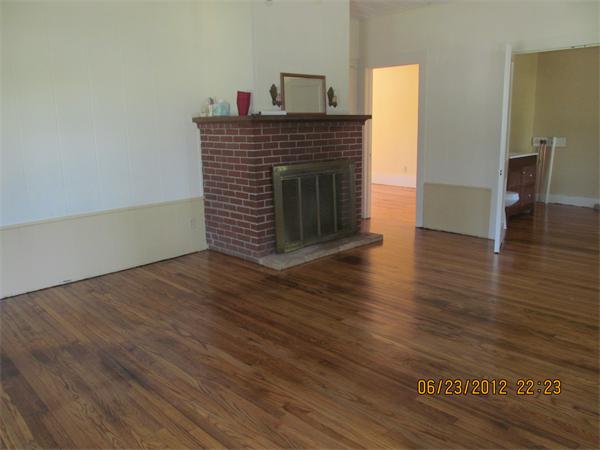 1574 Main Road Granville, MA 01034 - Photo 13 of 13 a view of a livingroom with wooden floor and a fireplace