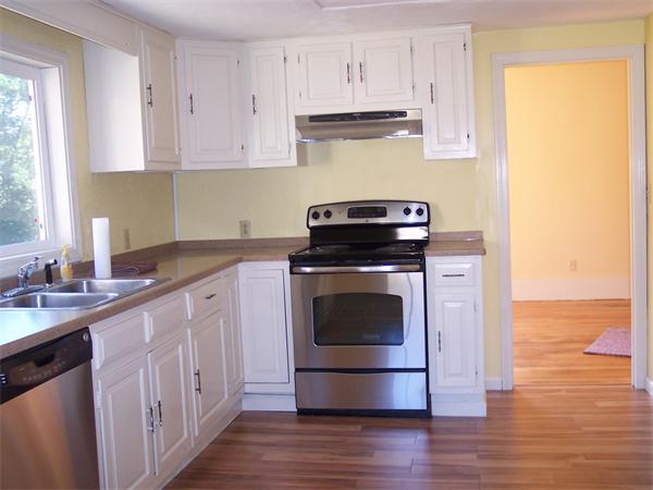 1574 Main Road Granville, MA 01034 - Photo 7 of 13 a kitchen with a stove sink and cabinets