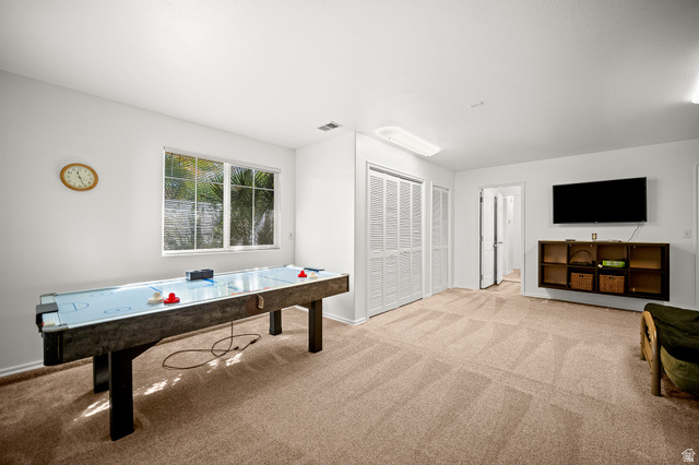 1825 West Mathis Park Place, Unit 46 St. George, UT 84770 - Photo 35 of 45 Game room featuring light colored carpet and baseboards
