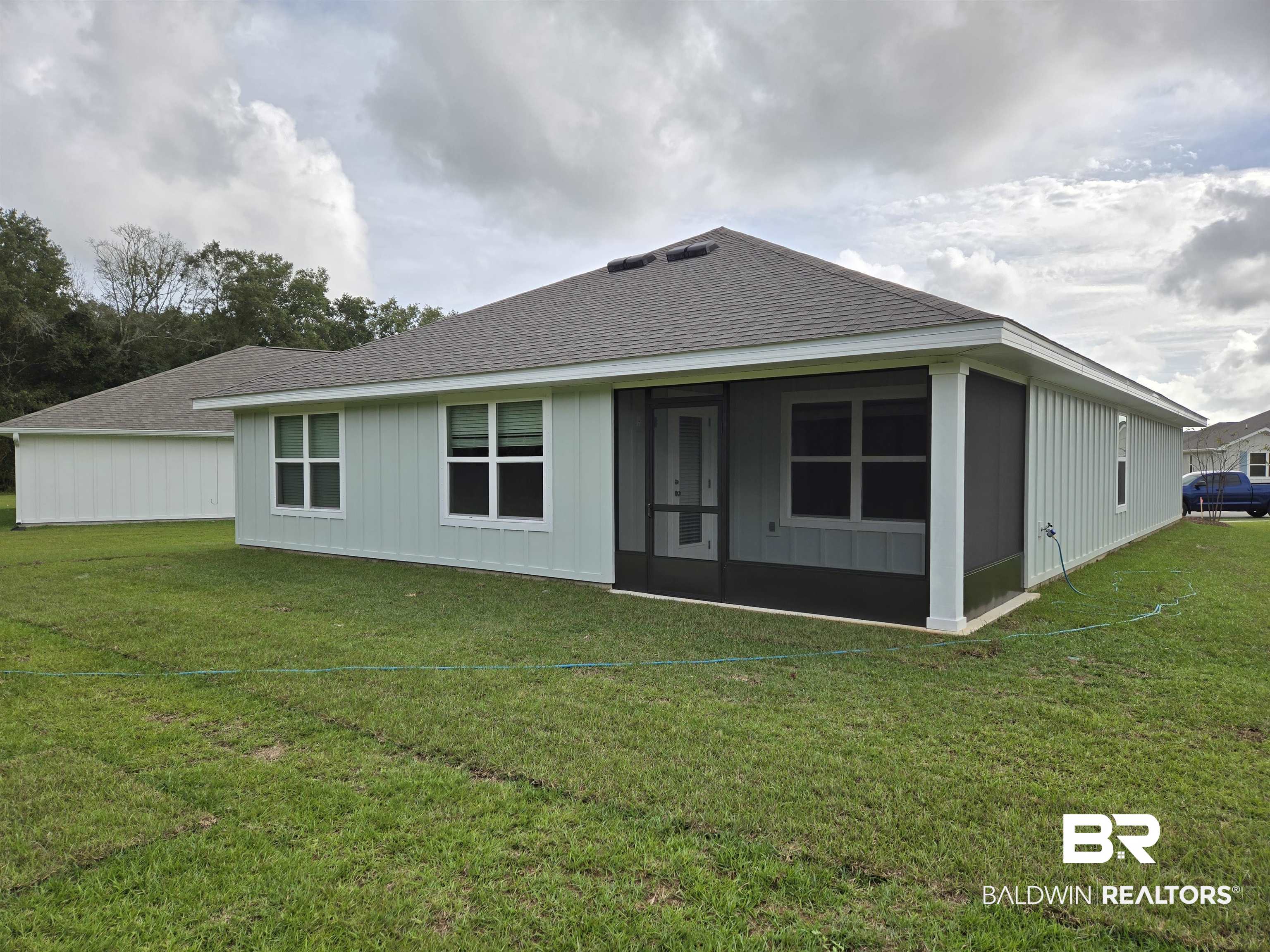 24194 Veranda Circle Elberta, AL 36530 - Photo 31 of 31 Back of property with a sunroom and a yard