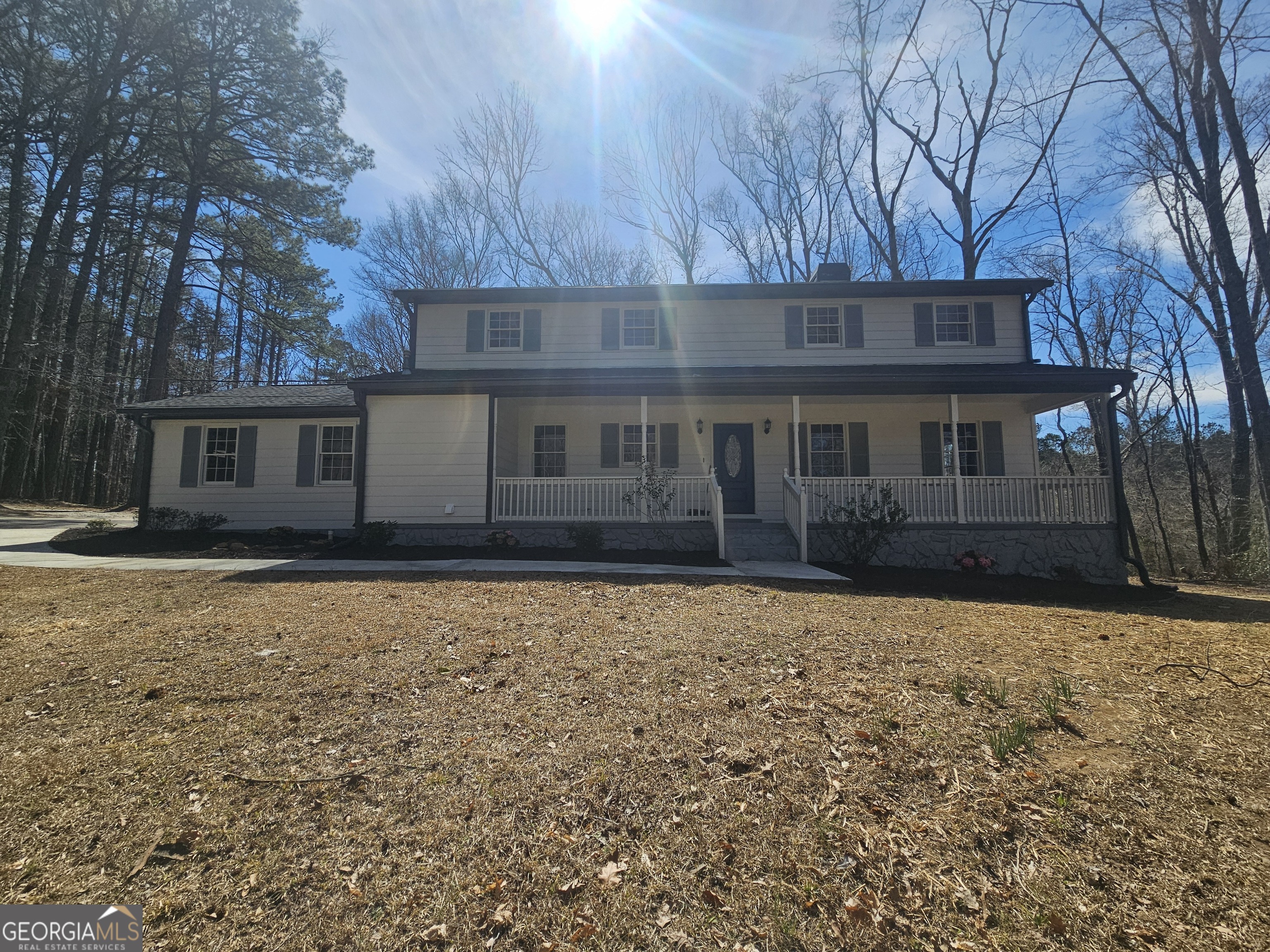 248 Milam Road Fayetteville, GA 30214 - Photo 1 of 1 a house with trees in the background