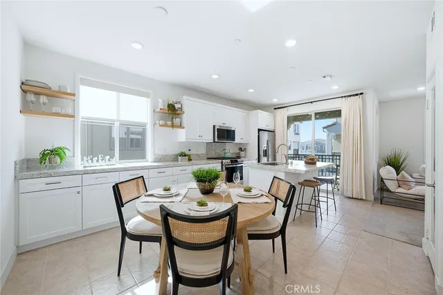 a dining room with furniture and window