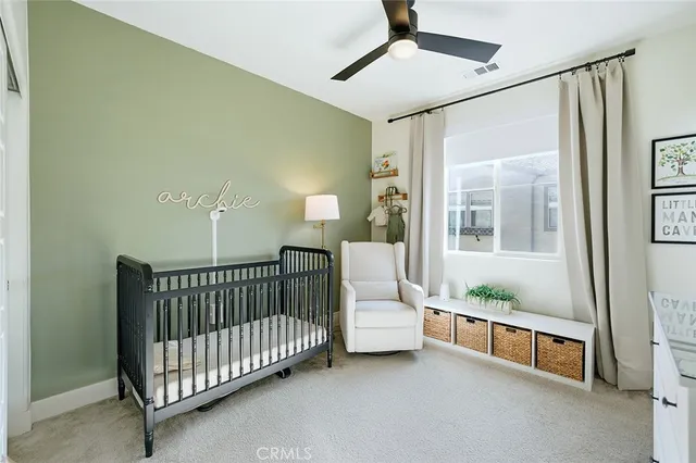 a bedroom with furniture and white walls