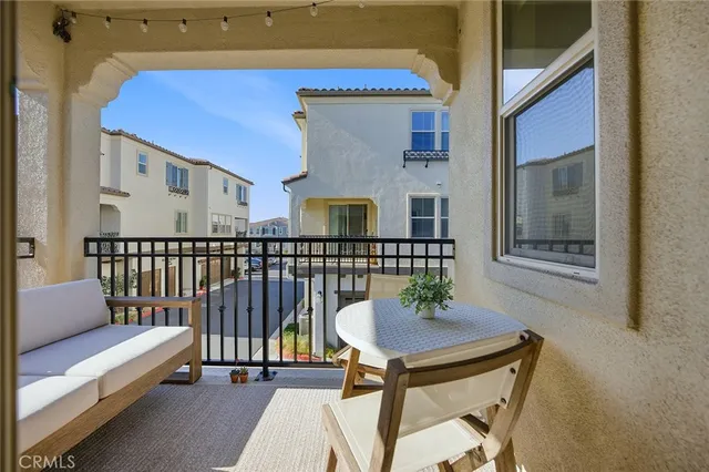 a view of a balcony with furniture