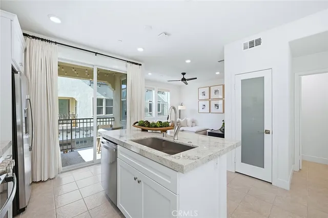 a kitchen that has a sink and a stove