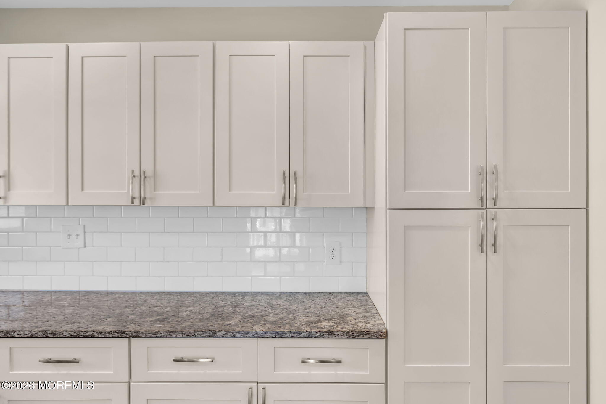 404 9th Avenue, Unit UPPR Belmar, NJ 07719 - Photo 13 of 29 a kitchen with granite countertop white cabinets and white stainless steel appliances
