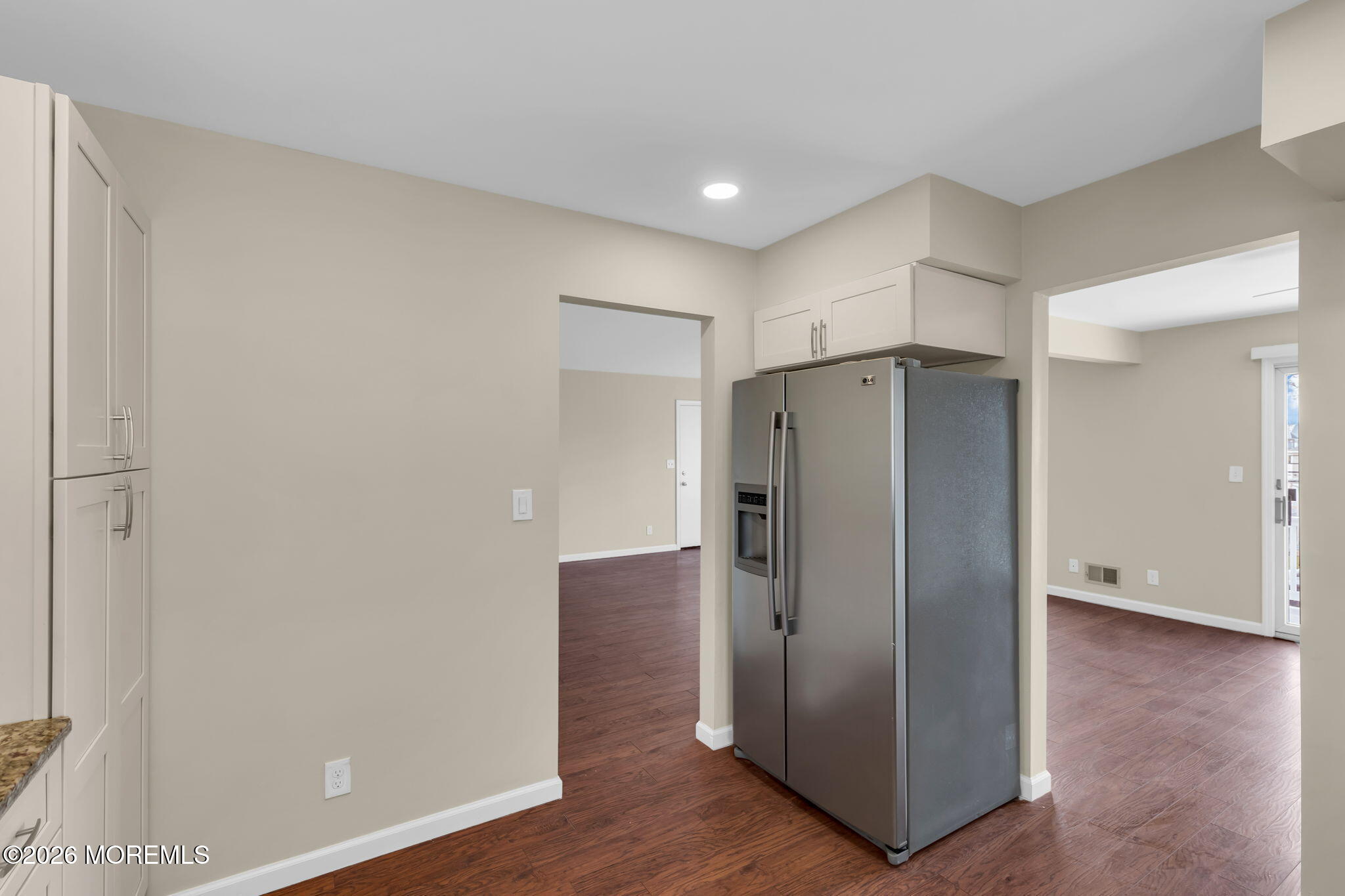 404 9th Avenue, Unit UPPR Belmar, NJ 07719 - Photo 14 of 29 a view of an empty room with wooden floor and a cabinet