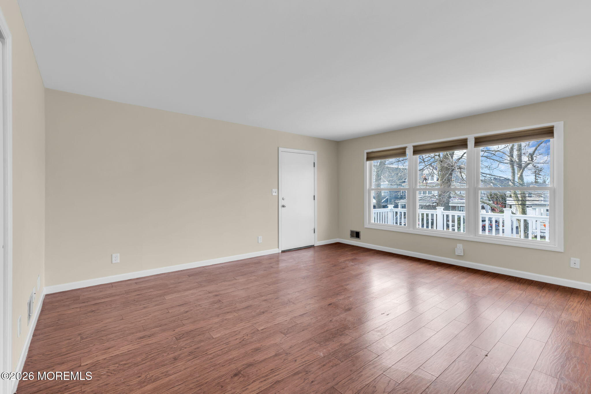 404 9th Avenue, Unit UPPR Belmar, NJ 07719 - Photo 16 of 29 a view of empty room with wooden floor and fan