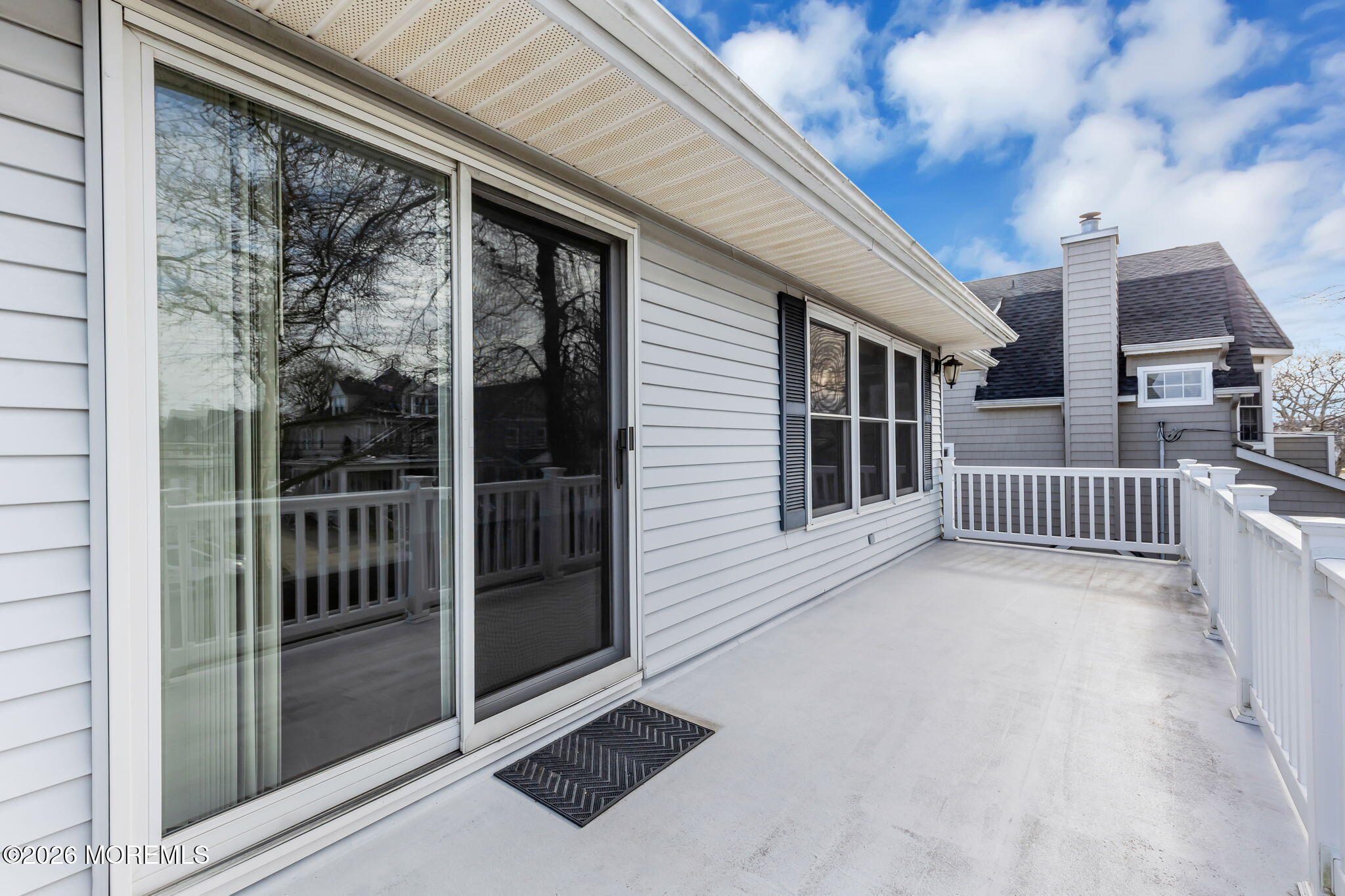 404 9th Avenue, Unit UPPR Belmar, NJ 07719 - Photo 17 of 29 a view of a balcony with a large window