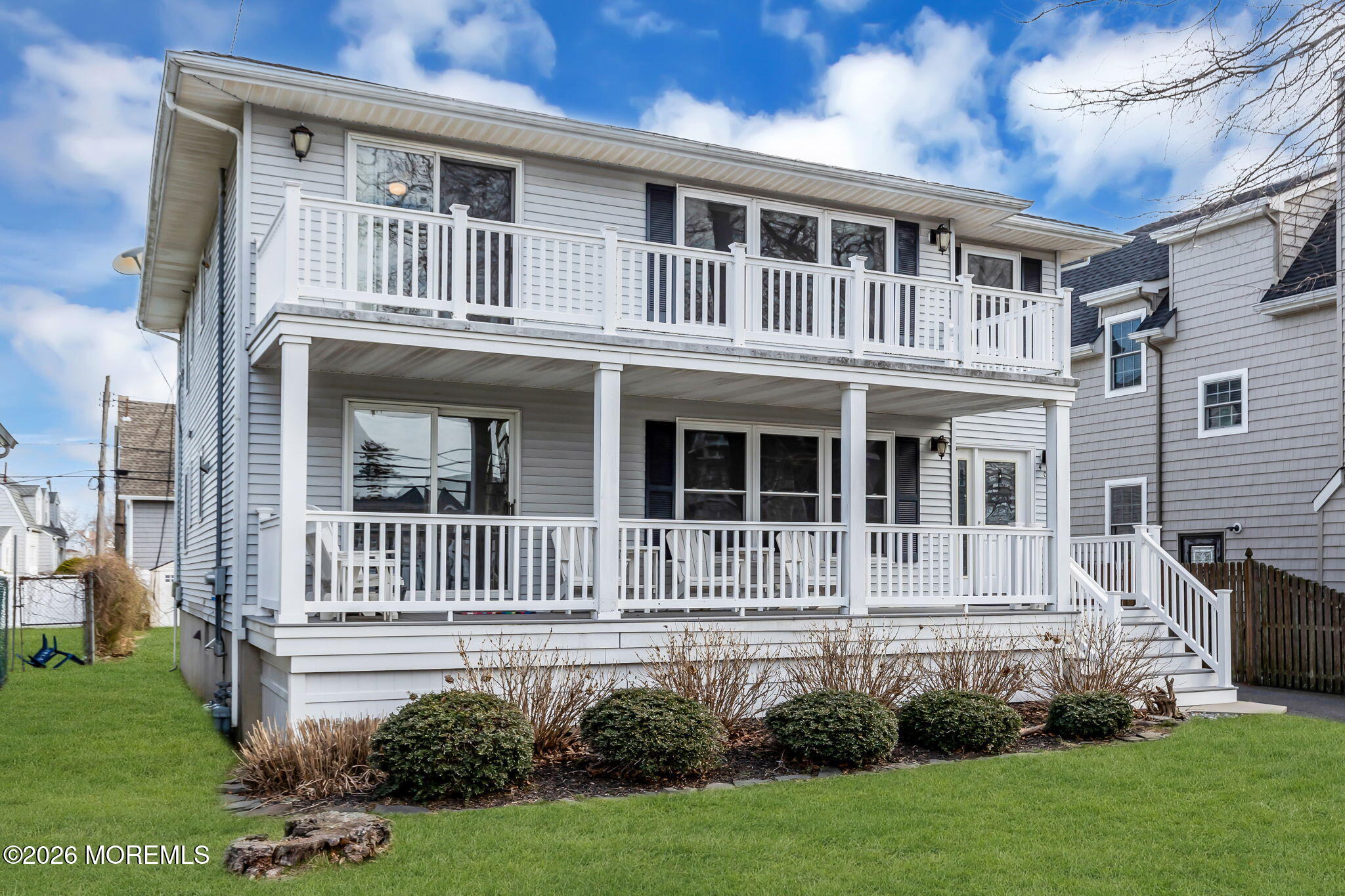 404 9th Avenue, Unit UPPR Belmar, NJ 07719 - Photo 2 of 29 a front view of a house with a yard
