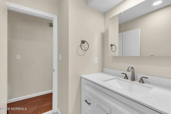 a bathroom with a sink and mirror
