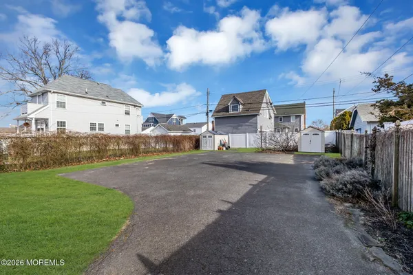 a city view with tall buildings and a yard