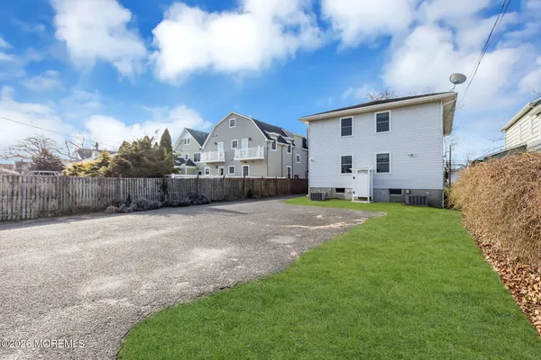 a view of a house with a back yard