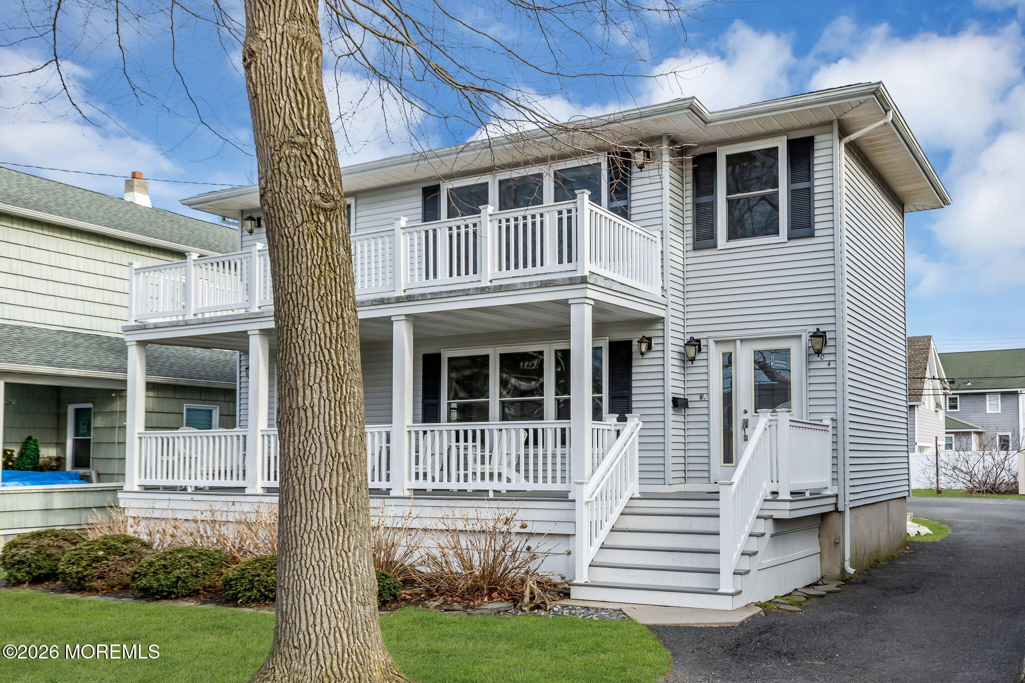 404 9th Avenue, Unit UPPR Belmar, NJ 07719 - Photo 3 of 29 a front view of a house with a yard