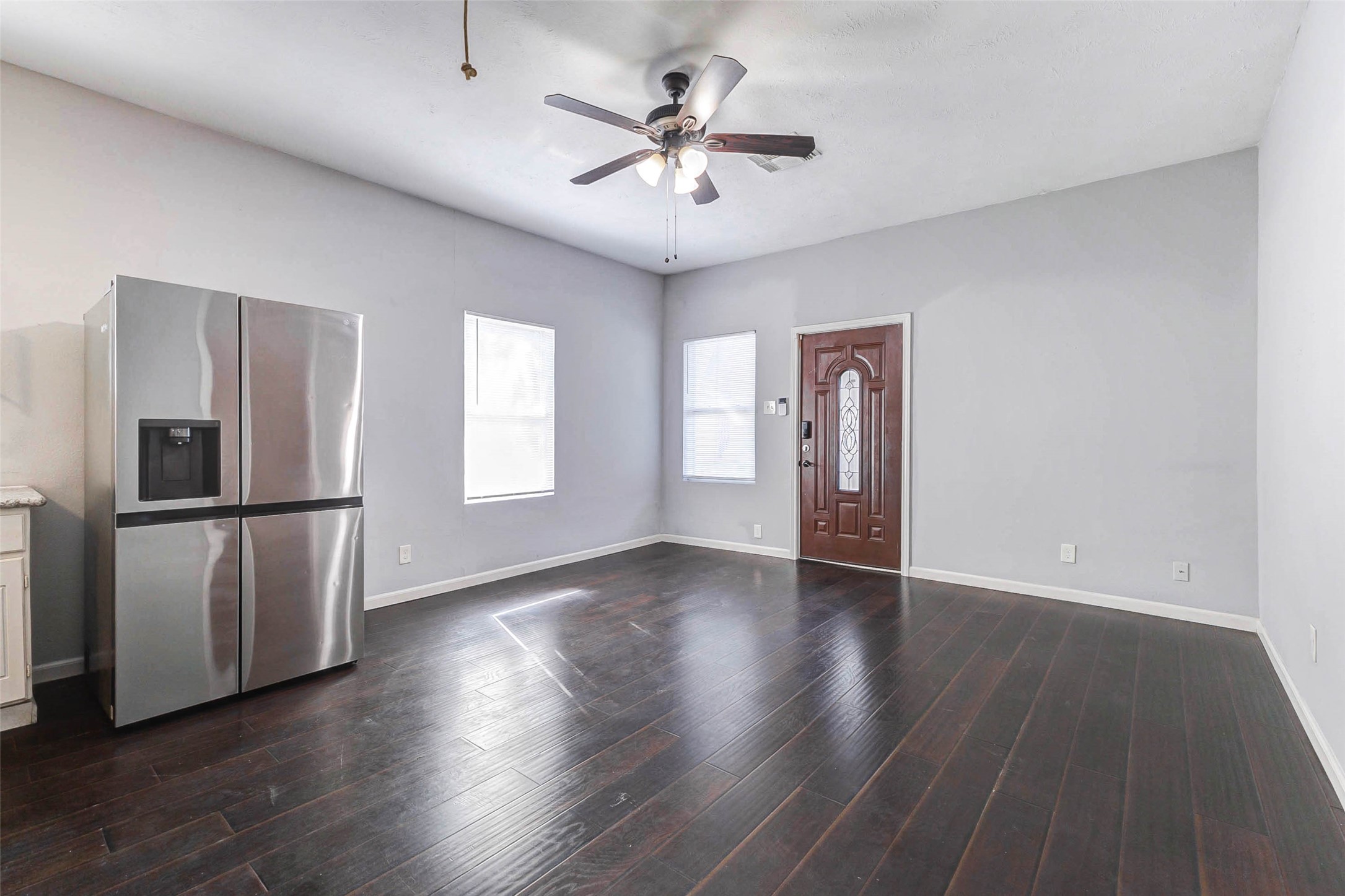 1606 Ruthven Street, Unit AB Houston, TX 77019 - Photo 6 of 6 a view of an empty room with window and wooden floor